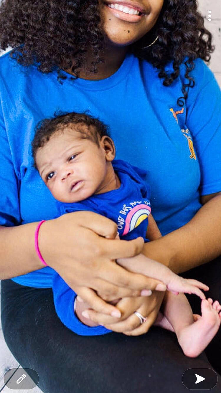 Alena is registered to the contest to win money with this photo: azure, baby, baby_toddler_clothing, blue, cool, eye, finger, gesture, hair, hairstyle, hand, happy, interaction, joint, mouth, person, product, shoulder, skin, sleeve