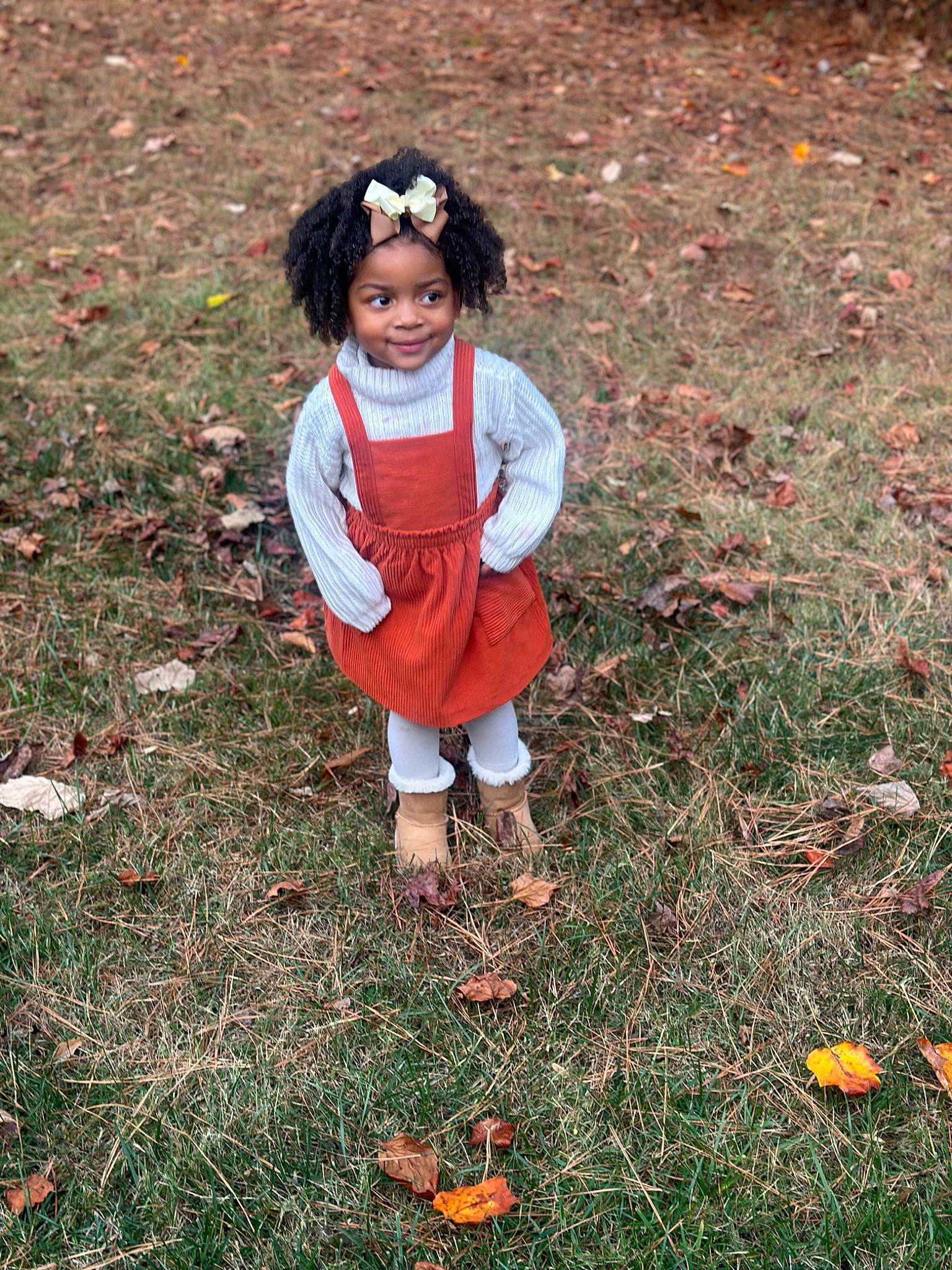 Denim is registered to the contest to win money with this photo: autumn, baby_toddler_clothing, boot, carmine, child, deciduous, fun, grass, happy, headwear, joy, leaf, people_in_nature, person, plant, recreation, shadow, sitting, smile, soil