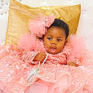Zara joined the competition — help win amazing prizes! baby, child, pink_dress, sequins, tulle, purse, golden_cushion, white_background, sitting, curious_expression, adorable, footwear, headband, portrait, indoor, fashion, cute, celebration, luxury, fancy