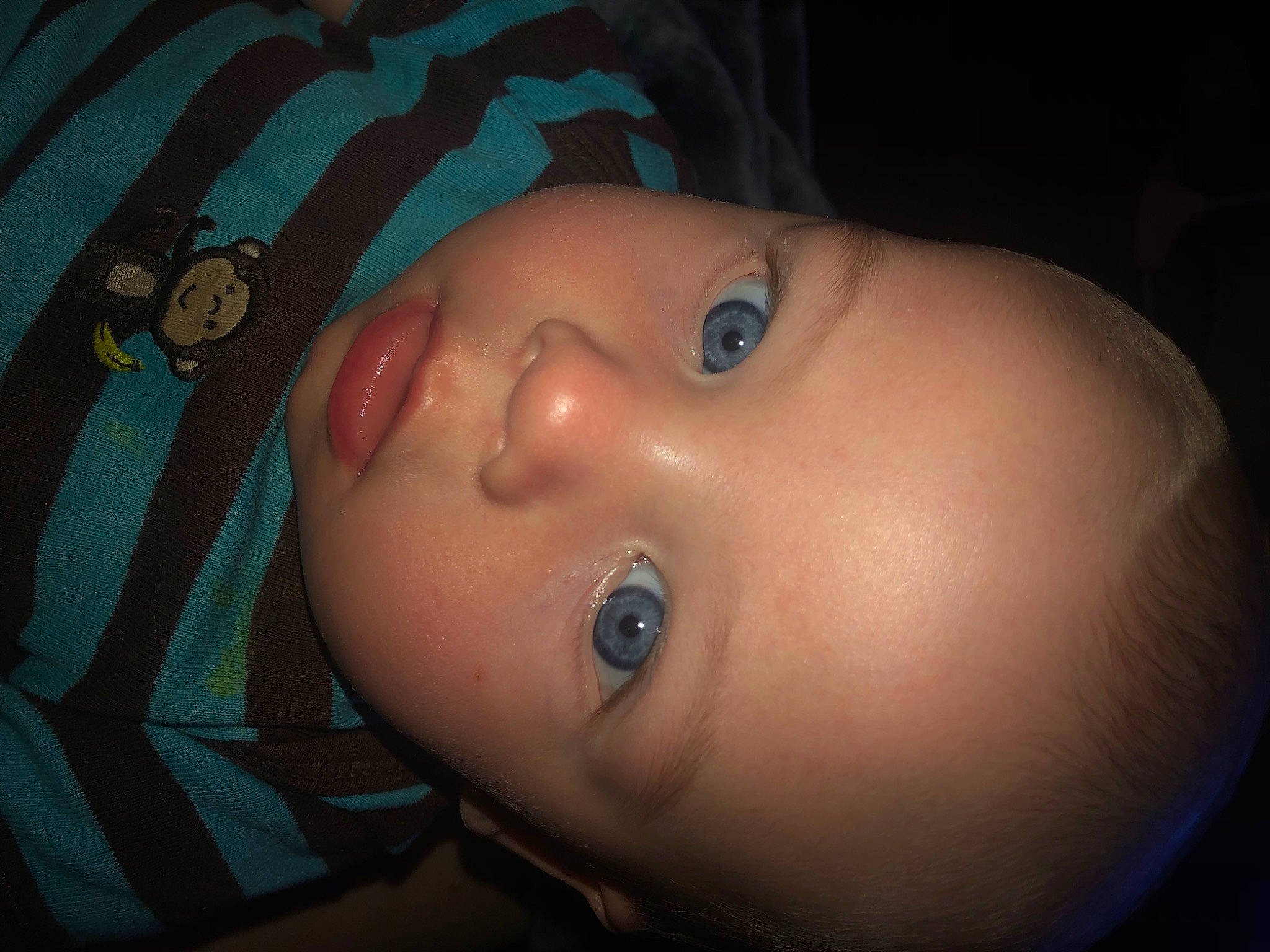 Wade is registered to the contest to win money with this photo: baby, black_hair, cheek, child, ear, electric_blue, eyelash, finger, flash_photography, forehead, headgear, human_body, iris, lip, mouth, neck, nose, person, skin, smile