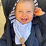 baby, child, smiling, blue_eyes, hood, striped, jacket, stroller, harness, happy, cute, toddler, clothing, portrait, face, infant, hand, outdoor, baby_bib, accessory