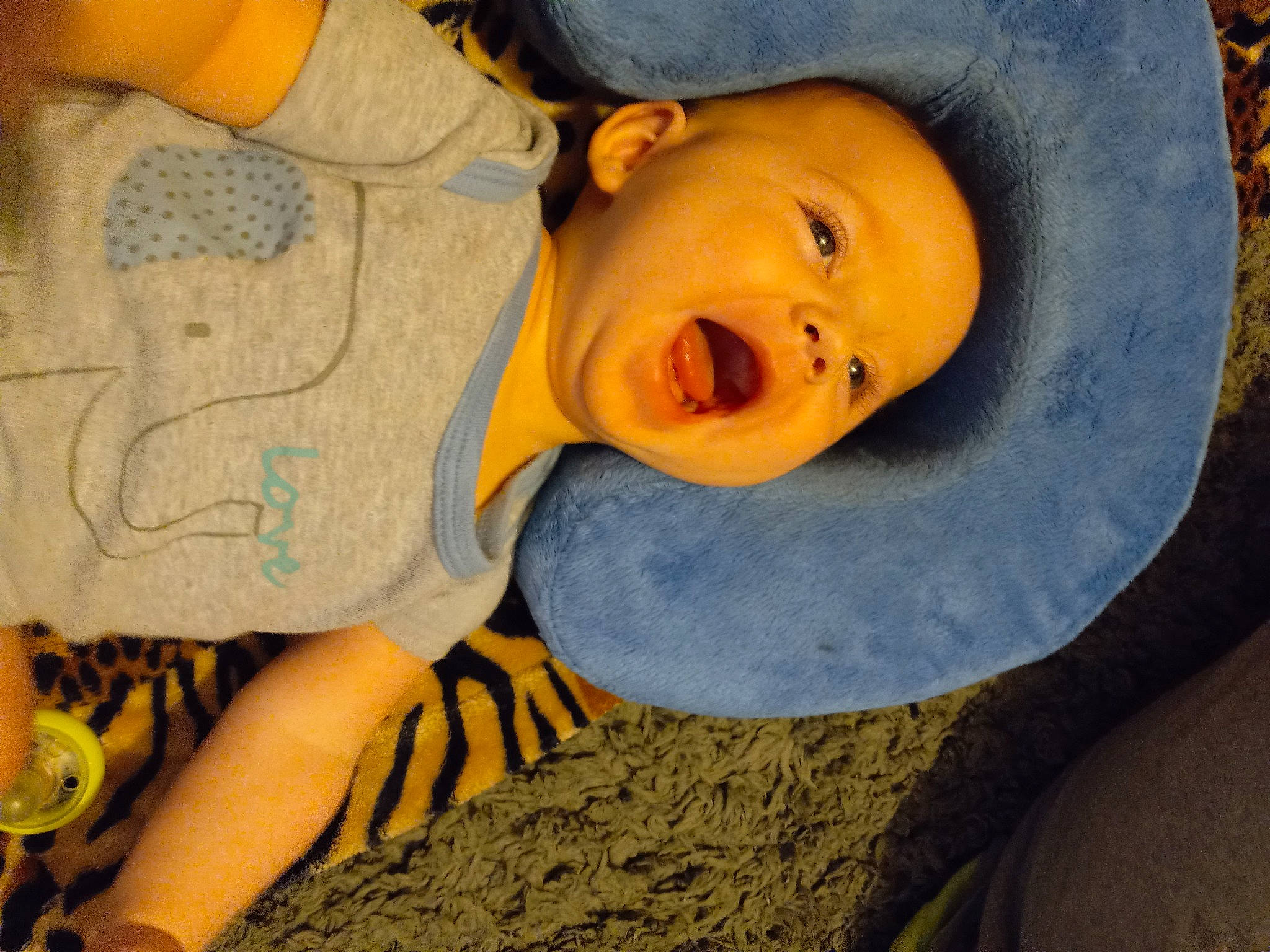 Erik is registered to the contest to win money with this photo: baby, baby_toddler_clothing, cheek, child, comfort, electric_blue, facial_expression, fun, hat, headgear, linens, mouth, nose, pattern, person, sitting, skin, sleeve, smile, toddler