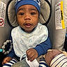 baby, infant, child, portrait, smiling, wide_eyed, sitting, car_seat, baby_bottle, plush_toy, stuffed_animal, striped_clothing, blue_clothing, bib, toy, indoor, close_up, face, safe, parenting