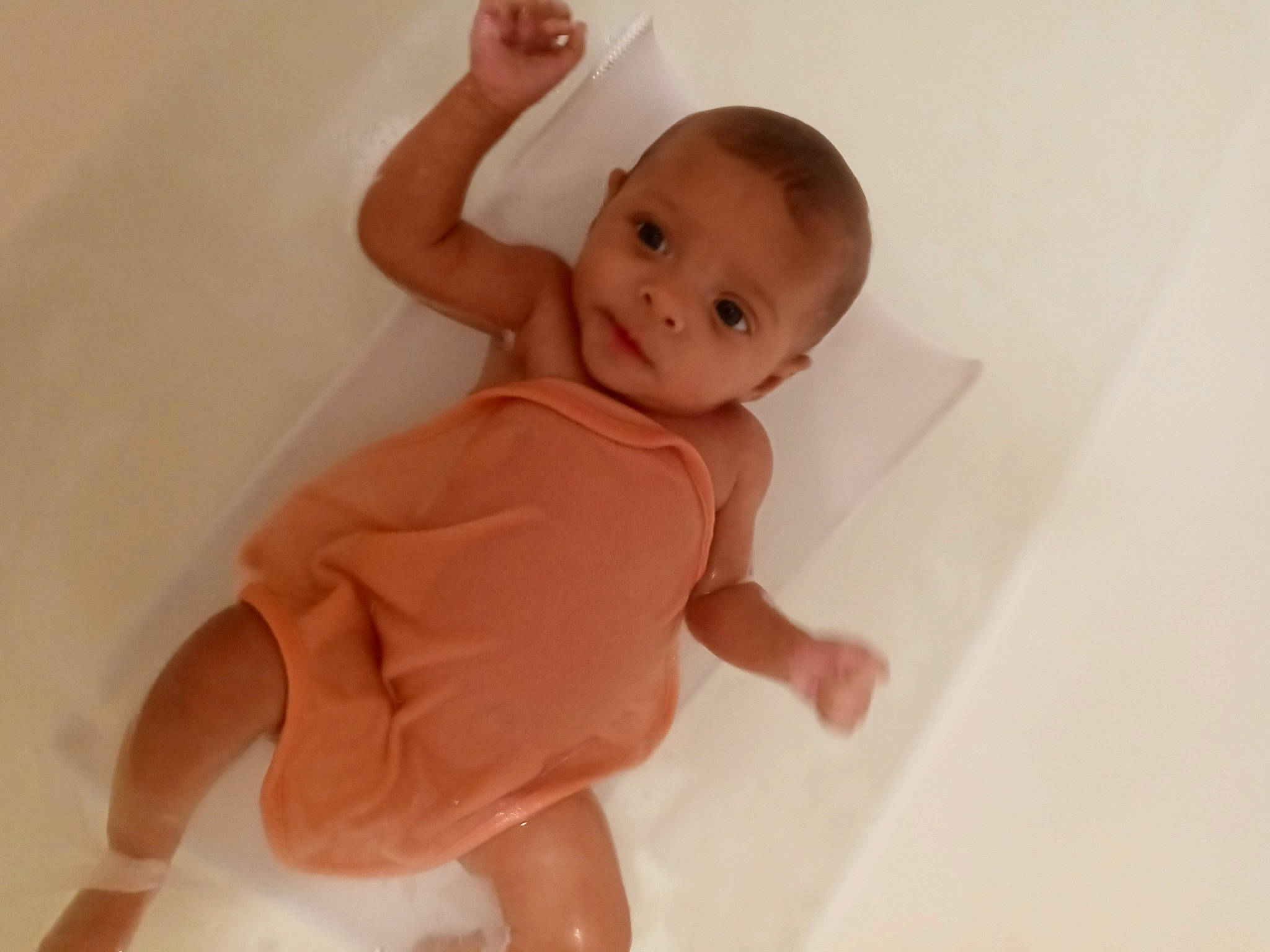 Taylah joined the competition — help win amazing prizes! baby, baby_toddler_clothing, cheek, chest, child, comfort, elbow, flooring, foot, human_body, human_leg, knee, neck, peach, person, sitting, sleeve, stomach, thigh, thumb