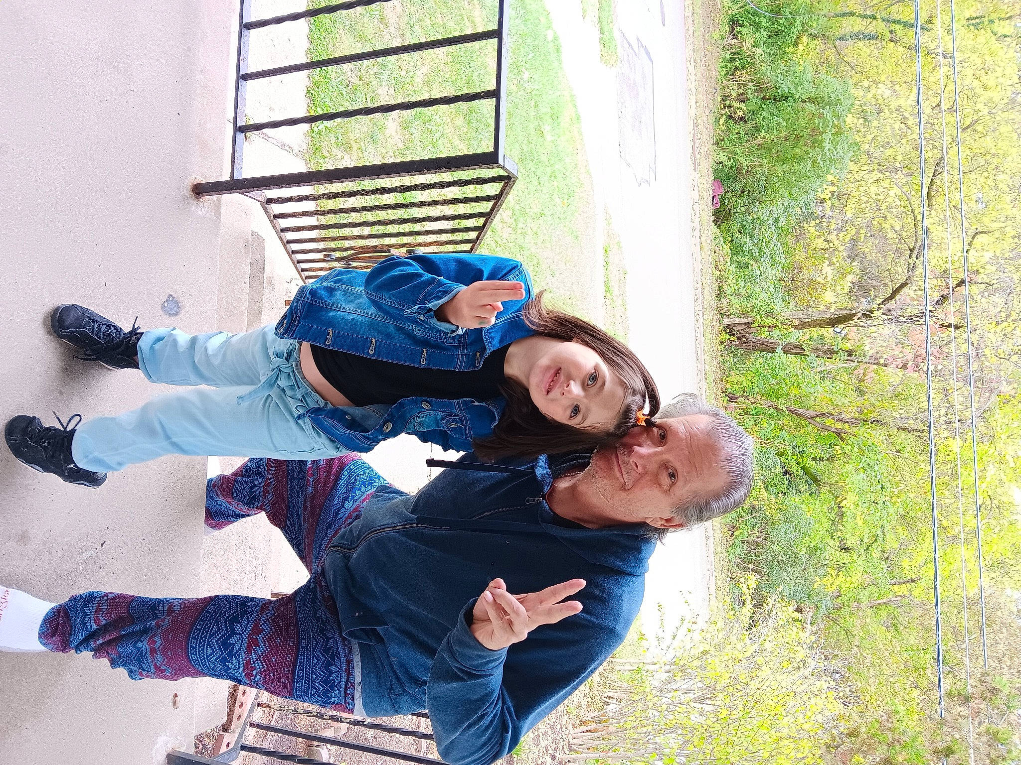 Madison is registered to the contest to win money with this photo: child, comfort, electric_blue, fun, grass, happy, hat, joy, leisure, people_in_nature, person, plant, sitting, smile, tree, winter