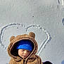 baby, child, snow, winter, blue_hat, bear_costume, sleeping, heart_shape, outdoor, cold, cute, cozy, clothing, face, headwear, frozen, footprints, nature, portrait, love