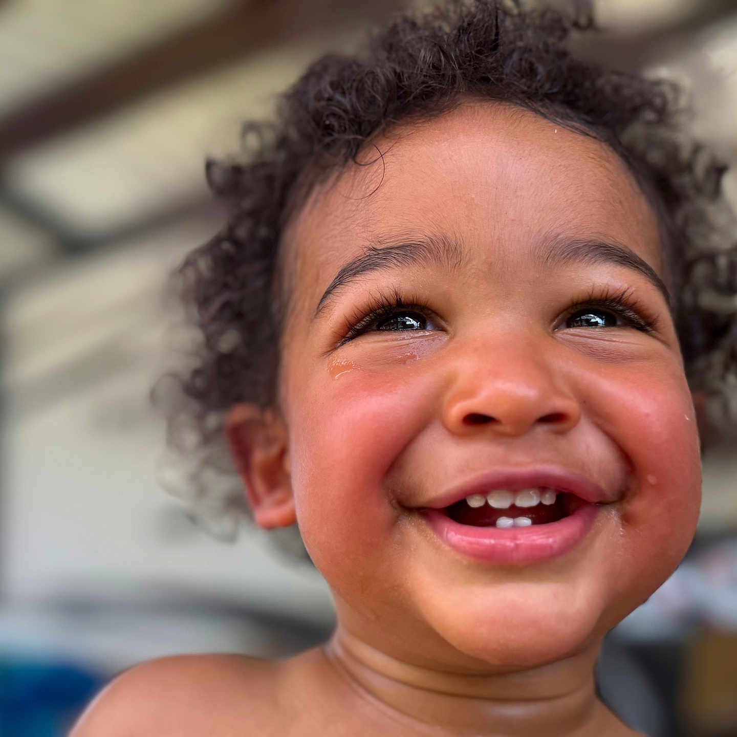 Tamãn is registered to the contest to win money with this photo: baby, child, closeup, curly_hair, cute, emotion, expression, face, happy, innocence, joy, natural_light, outdoor, person, portrait, skin, smiling, tears, toddler, young