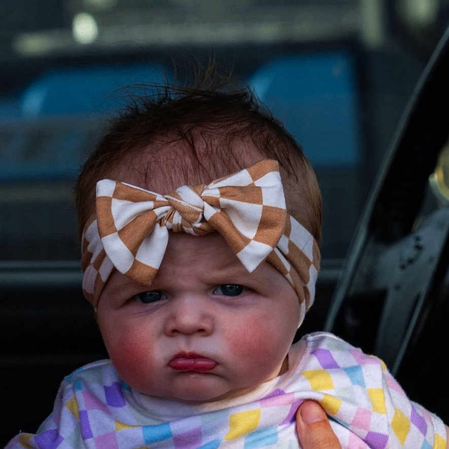 Charlotte is registered to the contest to win money with this photo: accessories, baby, bodypart, computer, electronics, face, finger, frown, hand, happy, head, laptop, newborn, pc, person, photography, portrait, sad, smile, sunglasses