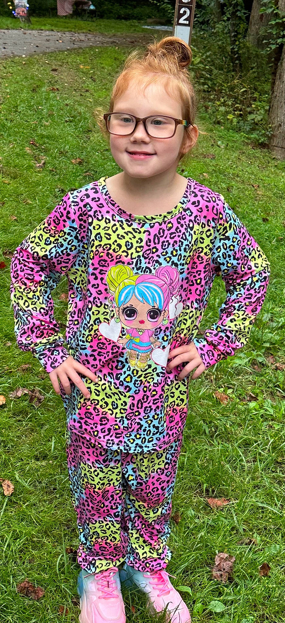 Raelynn is registered to the contest to win money with this photo: baby_toddler_clothing, child, eyewear, fun, glasses, grass, green, happy, head, joy, magenta, pattern, people_in_nature, person, pink, plant, purple, sleeve, spring, t_shirt