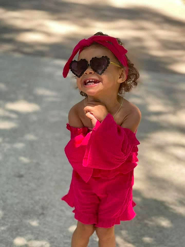 Brianna joined the competition — help win amazing prizes! day_dress, dress, eyewear, face, gesture, glasses, goggles, happy, hat, headwear, lip, one_piece_garment, person, pink, recreation, sleeve, smile, street_fashion, sunglasses, toddler