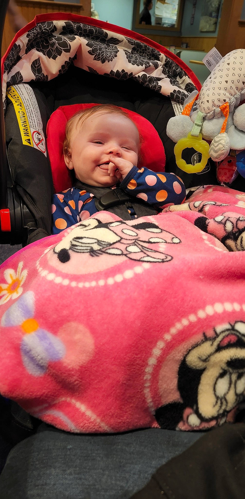 Rosalie is registered to the contest to win money with this photo: baby, baby_toddler_clothing, black, cheek, comfort, cool, happy, head, linens, mammal, mouth, orange, organ, person, photograph, pink, red, smile, textile, toddler