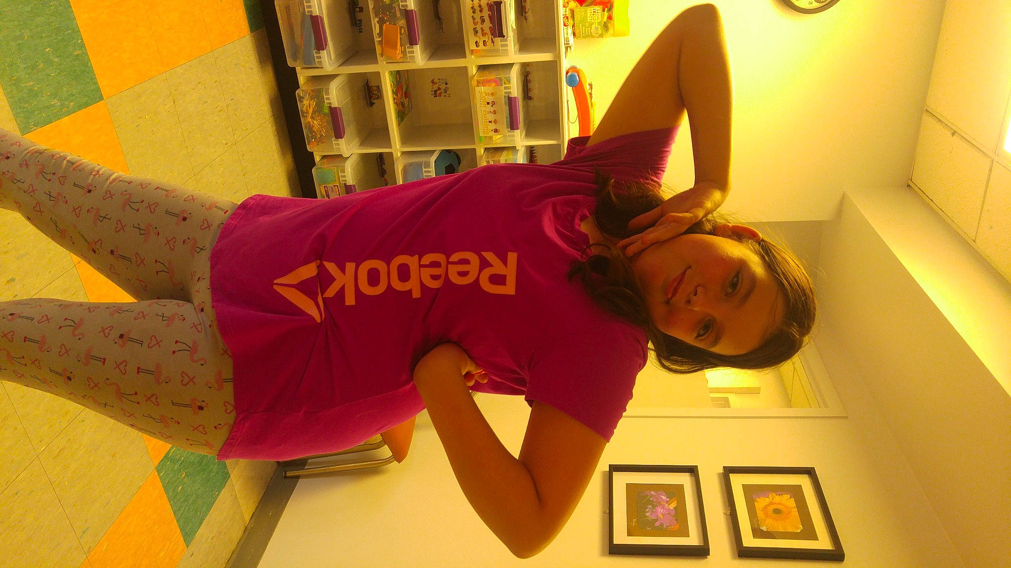 Kelly-ann participe au concours pour gagner de l'argent avec cette photo : arm, clock, clothing, elbow, fun, headgear, human_body, joint, joy, knee, leg, mammal, neck, orange, person, picture_frame, shoulder, sleeve, sportswear, t_shirt