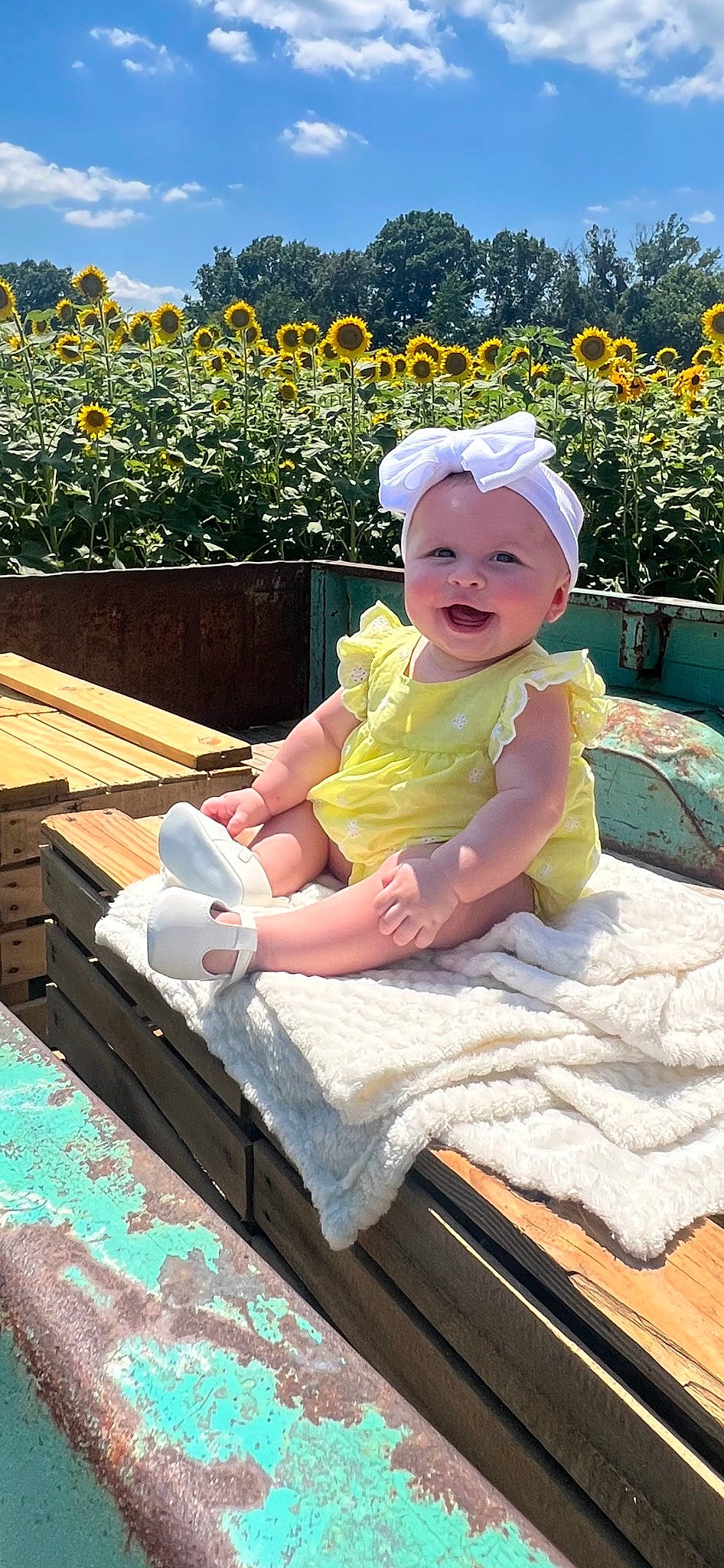 Brayleigh is registered to the contest to win money with this photo: baby, baby_toddler_clothing, child, flower, grass, happy, hat, headgear, headwear, leaf, leisure, outdoor_furniture, person, pink, plant, smile, summer, sun_hat, toddler, tree