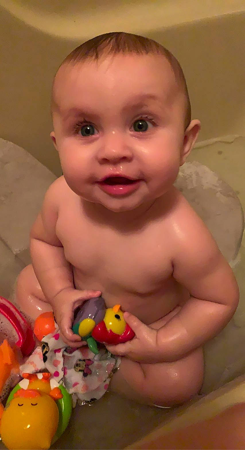 Brayleigh joined the competition — help win amazing prizes! baby, baby_bathing, bath_toy, bathing, cheek, chest, eye, eyelash, finger, human_body, iris, lip, mouth, nose, person, pink, skin, smile, toddler, toy