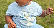Malana joined the competition — help win amazing prizes! toddler, child, grass, outdoor, blue_clothing, bow, curly_hair, jewelry, bracelet, necklace, earring, sitting, leggings, butterfly_pattern, serious_expression, baby, nature, cute, portrait, daylight