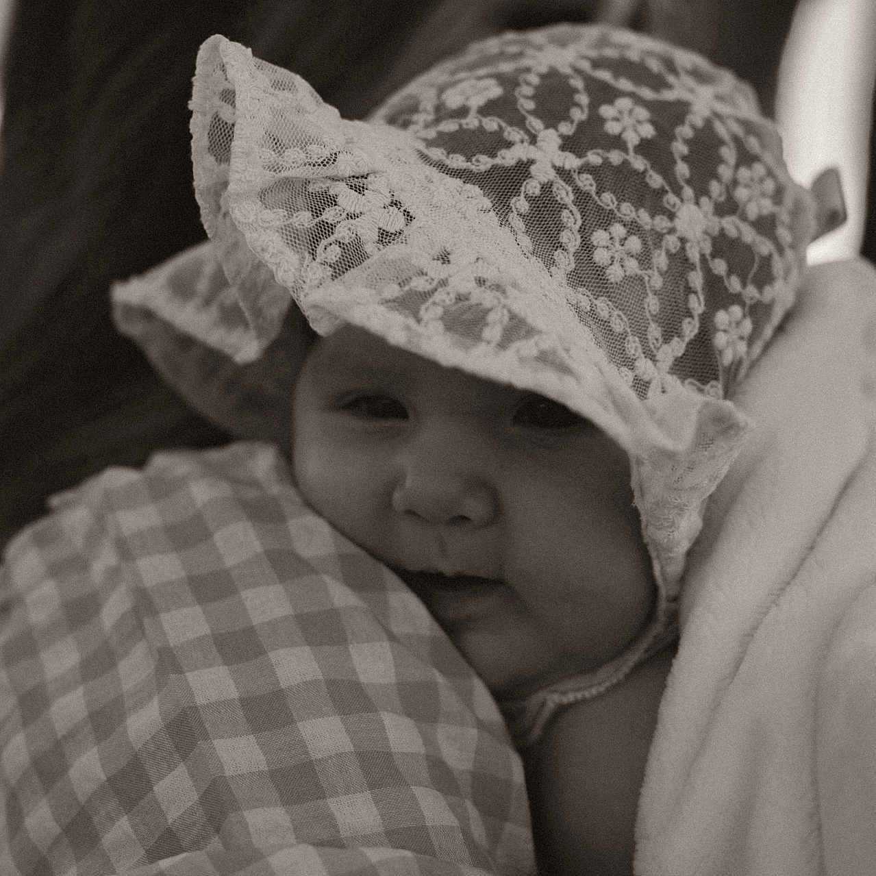 Grace Taylor Boyd is registered to the contest to win money with this photo: baby, bodypart, bonnet, cap, clothing, face, finger, hand, hat, head, newborn, person, photography, portrait, sunhat