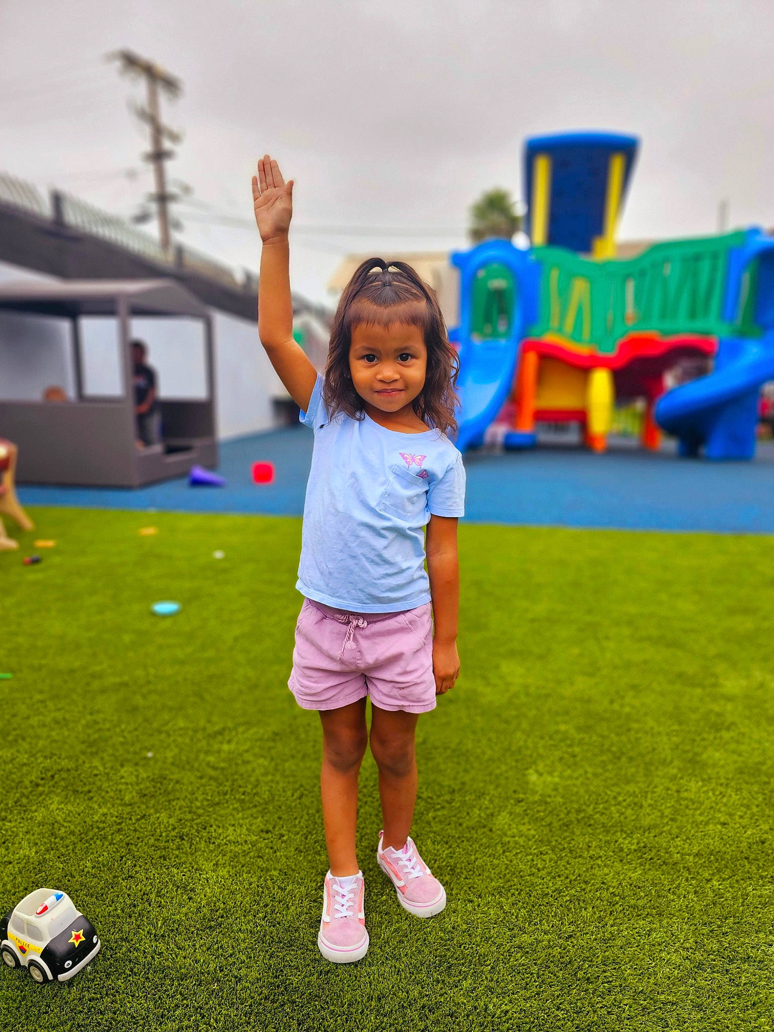 Kylee is registered to the contest to win money with this photo: ball, child, competition_event, flooring, football, fun, grass, happy, human_settlement, leisure, person, play, recreation, shorts, sky, soccer, soccer_ball, sports, sports_equipment, t_shirt