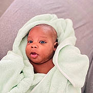 Kaylon participe au concours pour gagner de l'argent avec cette photo : baby, infant, towel, wrapped, soft, mint_green, skin, face, eyes, mouth, cozy, cute, newborn, portrait, indoor, expression, child, person, blanket, comfort