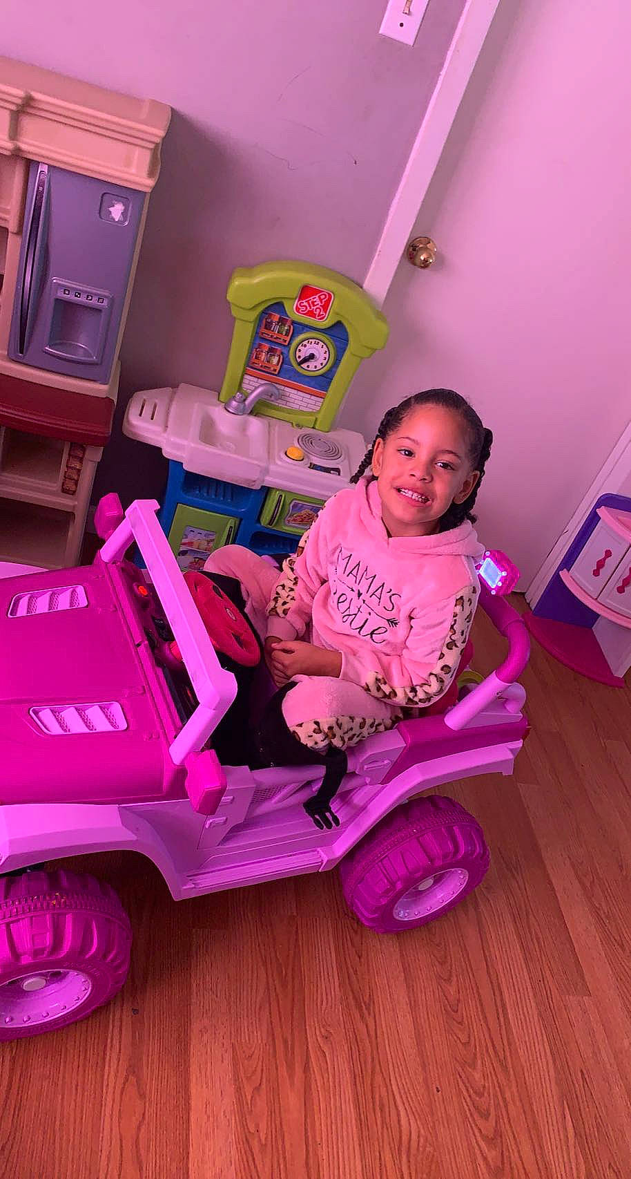 Dorothy is registered to the contest to win money with this photo: automotive_tire, baby_toddler_clothing, beauty, child, drawer, fun, happy, joy, magenta, person, pink, product, purple, riding_toy, t_shirt, tire, toddler, toy, vehicle, violet