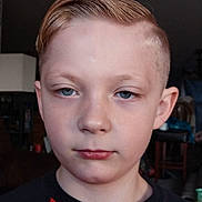 Colten joined the competition — help win amazing prizes! background, black_shirt, blue_eyes, boy, calm, casual_clothing, child, closeup, face, furniture, human, indoor, indoors, light_hair, neutral_expression, person, portrait, red_shirt, short_hair, young