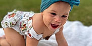 Evelina joined the competition — help win amazing prizes! baby, headband, bow, crawling, blanket, outdoor, grass, smiling, child, happy, infant, cute, person, nature, portrait, apparel, headwear, skin, baby_clothes, daylight