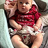 Aurora joined the competition — help win amazing prizes! baby, infant, child, cute, clothing, red_shirt, floral_shorts, blanket, soft_texture, indoors, portrait, sitting, chubby, curious_eyes, hands, legs, foot, expression, comfortable, cozy