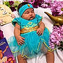 aladdin, baby, blue_dress, celebration, cute, flowers, gold_belt, headband, infant, laying_down, magic_lamp, peaceful, pink_flowers, portrait, purple_flowers, sleeping, soft_fabric, storybook, tulle_skirt, two_months