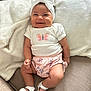 Catalina is registered to the contest to win money with this photo: baby, blanket, butterfly, child, clothing, comfort, couch, cute, footwear, happy, headband, indoor, infant, pink, portrait, sandals, sitting, smile, soft, white