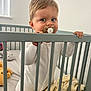 Sami is registered to the contest to win money with this photo: baby, crib, pacifier, blanket, toy, infant, child, nursery, grip, sleepwear, bedroom, soft_lighting, indoor, person, cute, toddler, hand, expression, furniture, home