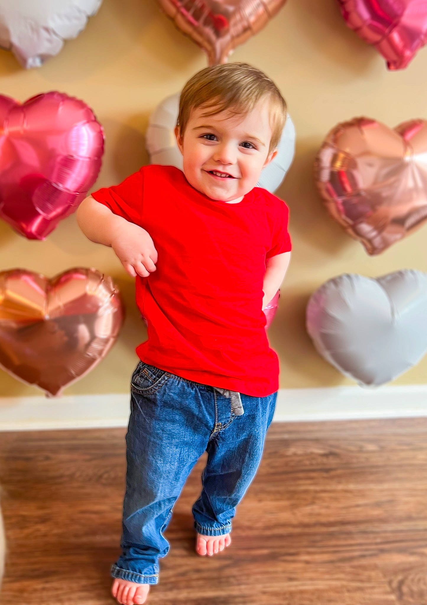 Greyson joined the competition — help win amazing prizes! baby_toddler_clothing, balloon, child, event, flooring, fun, gesture, happy, hardwood, jeans, joint, joy, leisure, organ, person, pink, red, sleeve, smile, standing