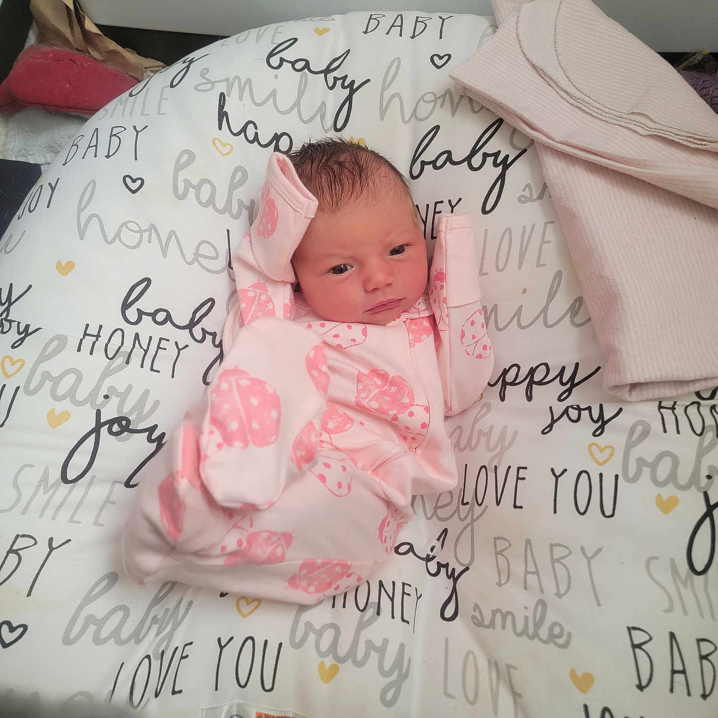 Scarlett is registered to the contest to win money with this photo: baby, bed, bedroom, blanket, crib, cushion, face, furniture, head, homedecor, indoors, infantbed, newborn, person, photography, pillow, portrait, quilt, room, text