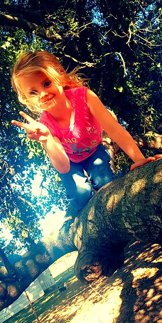 Kylie is registered to the contest to win money with this photo: beauty, branch, fawn, happy, jeans, joy, leisure, long_hair, people_in_nature, person, photo_shoot, photography, plant, smile, summer, sunlight, tree