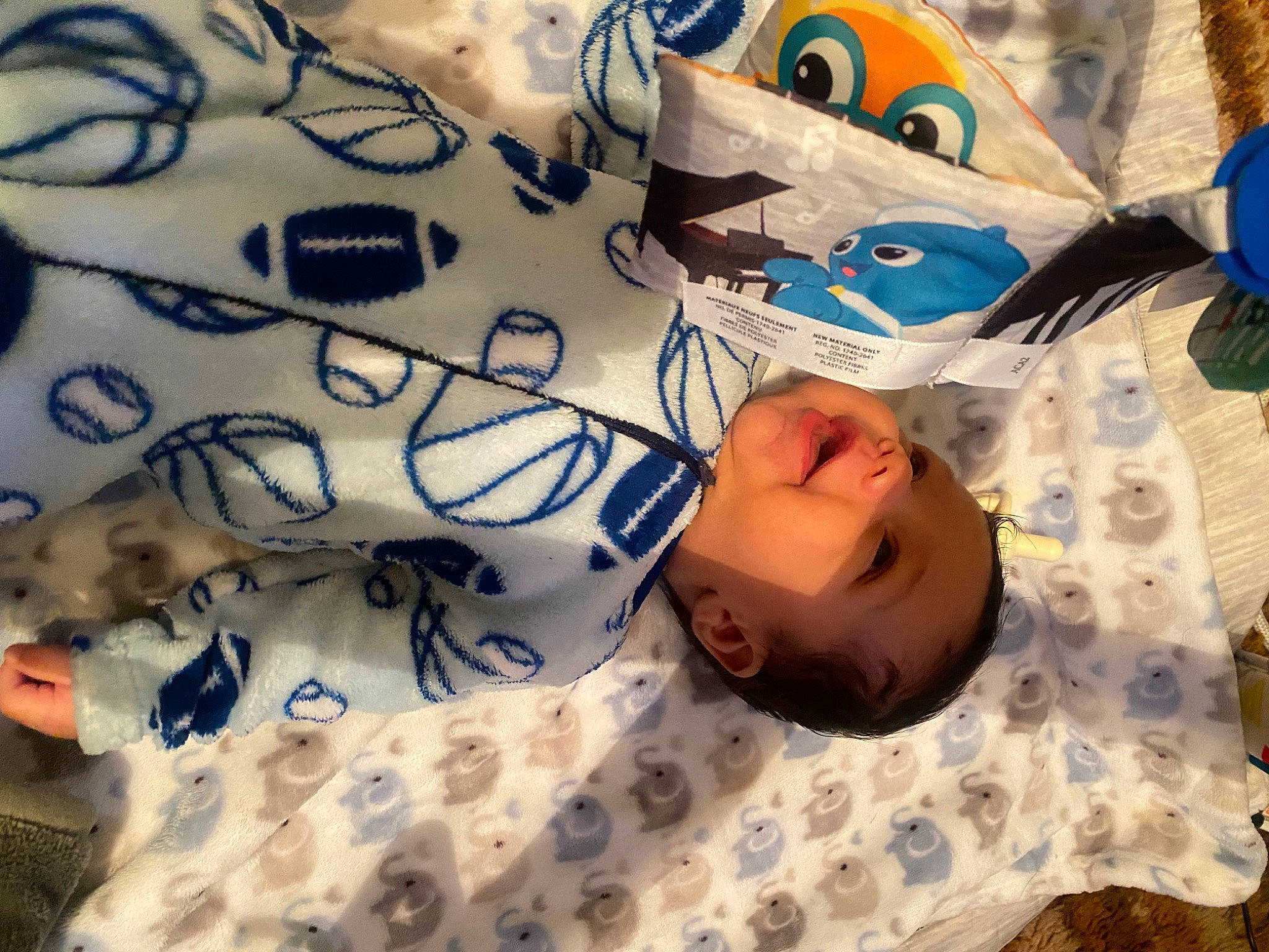 Ahmir Jr is registered to the contest to win money with this photo: baby, baby_toddler_clothing, bed, bed_sheet, bedding, bedtime, child, comfort, electric_blue, happy, linens, pattern, person, room, sleep, sleeve, smile, textile, toddler