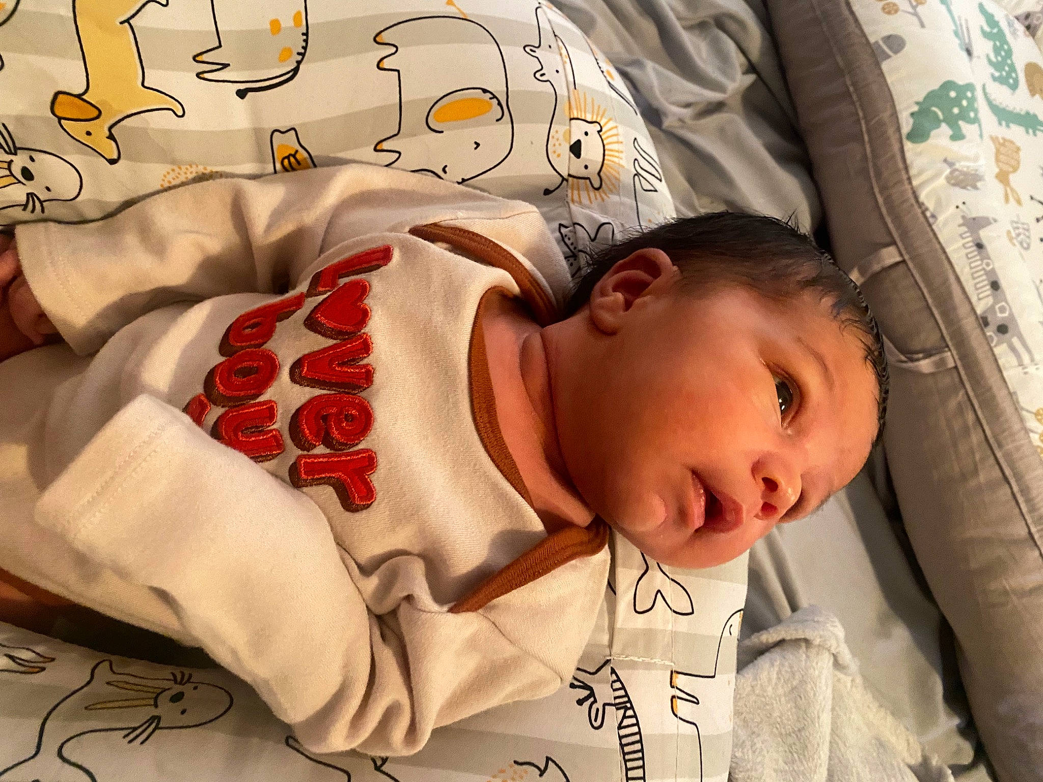 Ahmir Jr joined the competition — help win amazing prizes! baby, baby_products, baby_safety, baby_sleeping, baby_toddler_clothing, bedding, bedtime, carmine, cheek, child, comfort, happy, linens, nap, pattern, person, room, skin, sleeve, textile