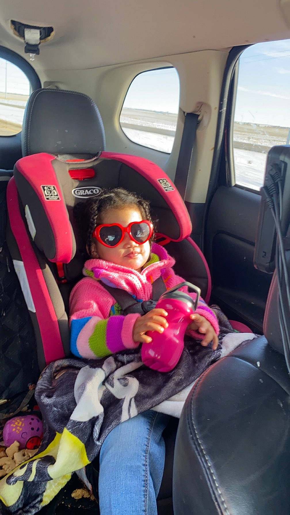Mary Bell is registered to the contest to win money with this photo: auto_part, automotive_design, automotive_exterior, car, car_seat, car_seat_cover, comfort, family_car, goggles, head_restraint, luxury_vehicle, mode_of_transport, motor_vehicle, person, seat_belt, steering_part, sunglasses, toddler, vehicle, vehicle_door