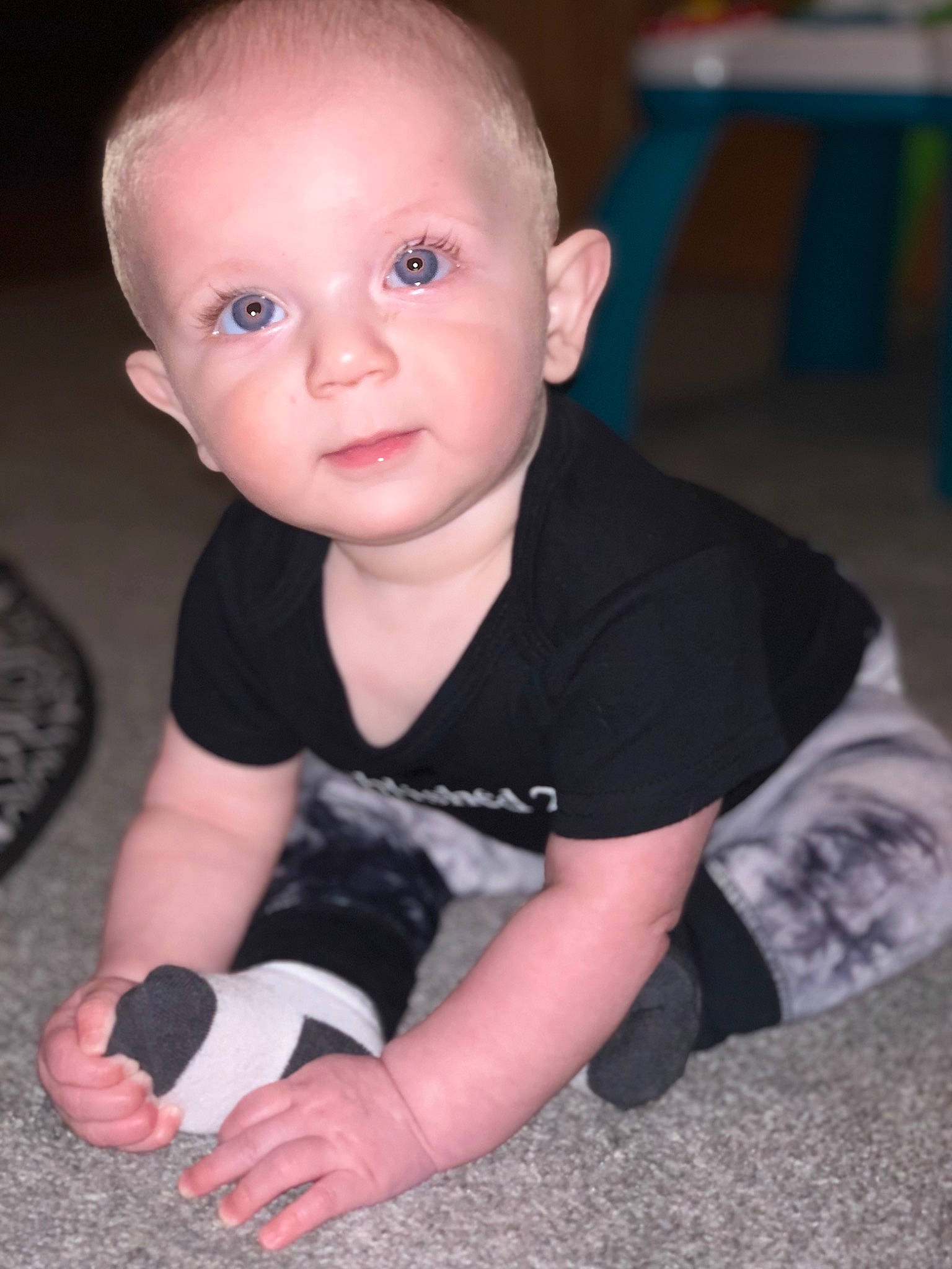Daylen is registered to the contest to win money with this photo: arm, baby, cheek, child, crawling, eye, face, finger, head, leg, nose, person, play, sitting, skin, smile, t_shirt, toddler, tummy_time