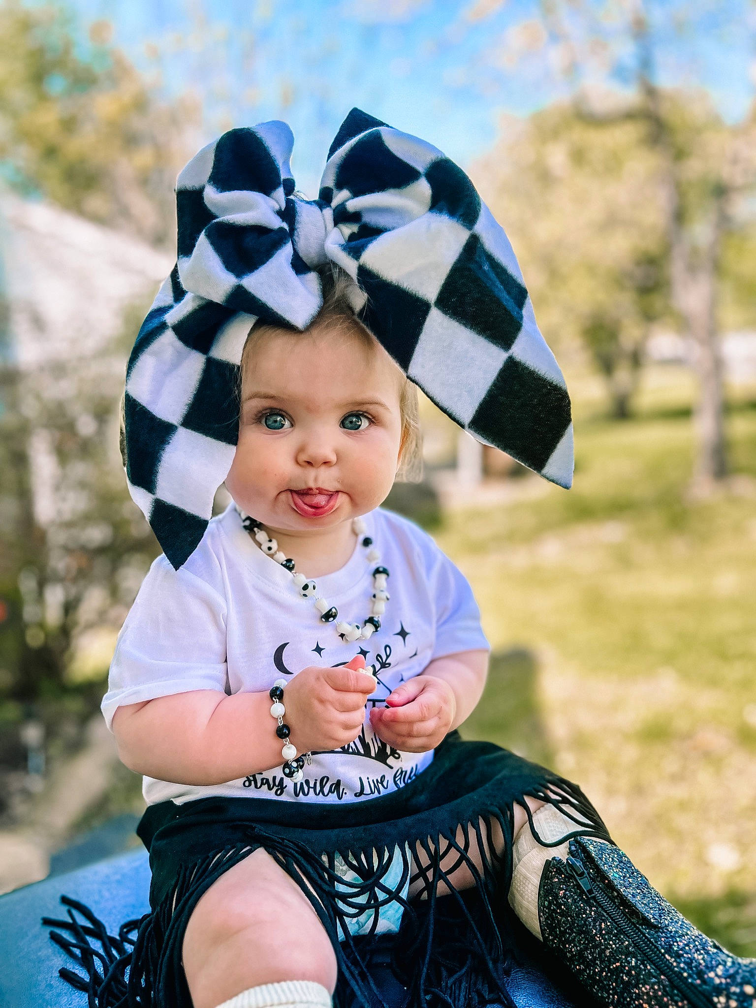 Brinley is registered to the contest to win money with this photo: baby_toddler_clothing, blue, child, costume_hat, dress, electric_blue, flash_photography, grass, happy, head, headgear, headpiece, headwear, outerwear, people_in_nature, person, photograph, pink, sleeve, smile