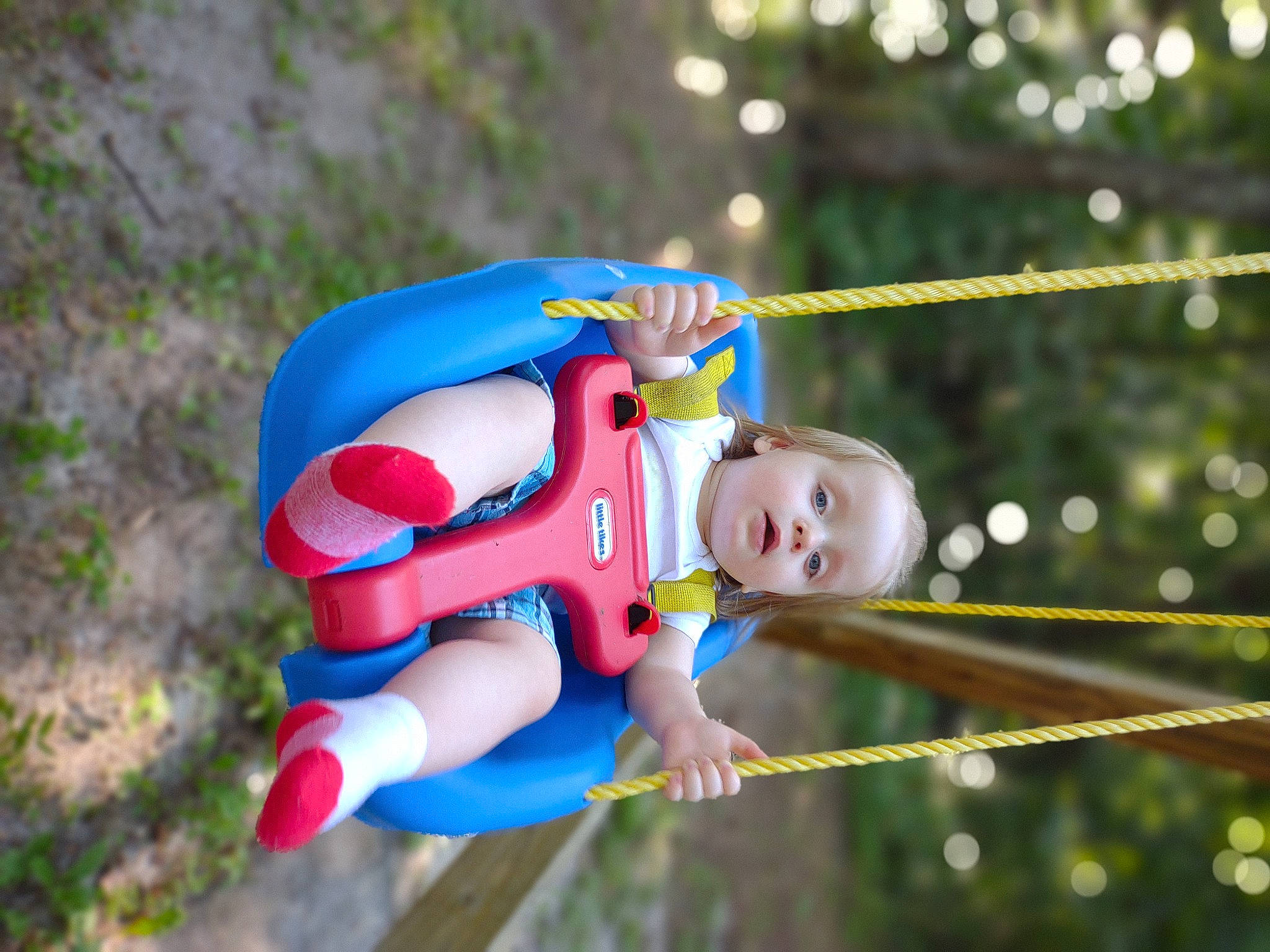 Devin Jr. is registered to the contest to win money with this photo: baby, baby_toddler_clothing, child, city, electric_blue, eye, fictional_character, fun, grass, happy, leisure, outdoor_play_equipment, person, plant, play, playground, recreation, smile, swing, toddler