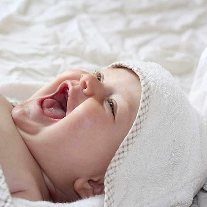 Elodie is registered to the contest to win money with this photo: baby, beauty, cheek, child, close_up, eye, face, facial_expression, happy, head, lip, mouth, nose, photograph, photography, pink, skin, sleep, smile, textile