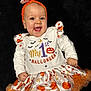 Héléna participe au concours pour gagner de l'argent avec cette photo : baby, black_background, celebration, child, costume, cute, dress, festive, halloween, happy, headband, holiday, infant, long_sleeve, orange, person, portrait, pumpkin, smiling, tutu