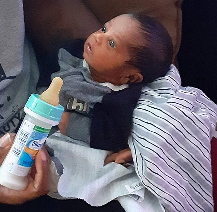 Keshawn joined the competition — help win amazing prizes! baby, baby_bottle, birth, bottle, bottled_water, child, drink, drinking_water, nose, person, plastic_bottle, product, toddler, water
