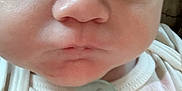 Flynn joined the competition — help win amazing prizes! baby, closeup, face, pacifier, infant, skin, mouth, nose, eyes, expression, child, clothing, white, cute, person, newborn, portrait, human, soft, tiny