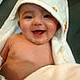 adorable, baby, bare_chest, bath_time, blanket, closeup, cozy, cute, eyes, happy, hooded_towel, indoor, infant, mouth_open, person, portrait, skin, smile, toothless_smile, towel