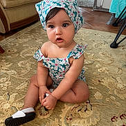 Alma participe au concours pour gagner de l'argent avec cette photo : toddler, child, baby, indoor, carpet, headscarf, romper, sitting, curious, expression, floor, home, furniture, shoe, patterned, floral, cute, person, portrait, natural_light