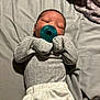 baby, newborn, pacifier, sleeping, bed, blanket, clothing, infant, soft, cute, resting, indoor, sleep, person, child, pajamas, blanket_folded, peaceful, small, cozy