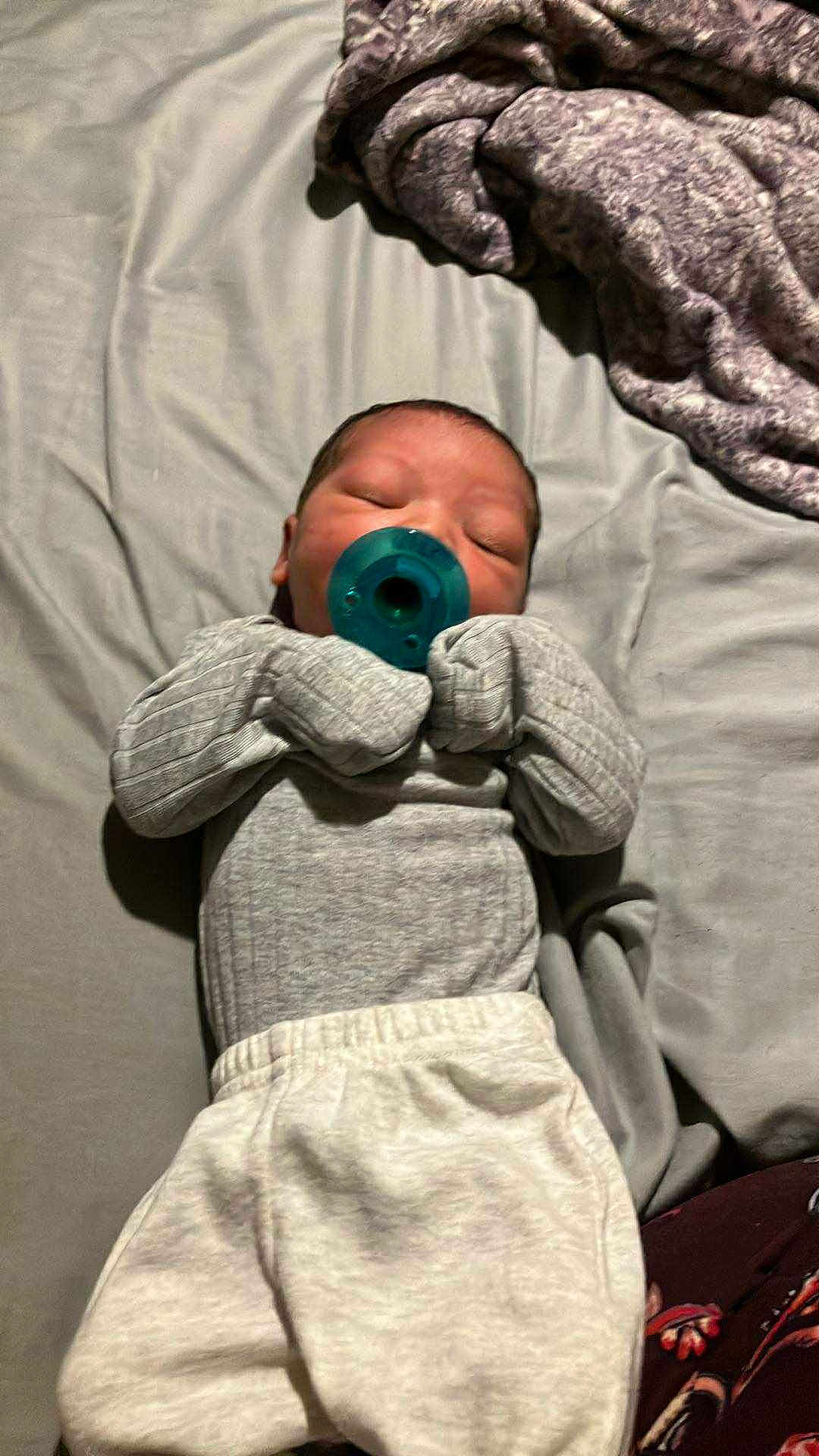 Kayari joined the competition — help win amazing prizes! baby, newborn, pacifier, sleeping, bed, blanket, clothing, infant, soft, cute, resting, indoor, sleep, person, child, pajamas, blanket_folded, peaceful, small, cozy