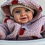 baby, infant, child, face, blue_eyes, hood, fleece_jacket, pink_clothing, hat, smile, cheeks, closeup, portrait, adorable, cozy, pattern, zipper, highchair, hand, skin