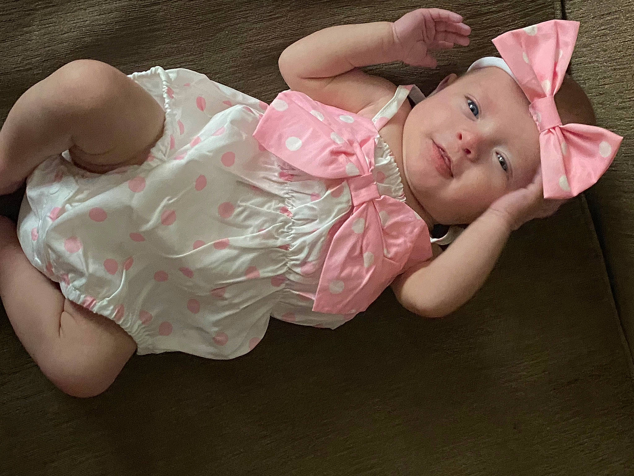 Lilith is registered to the contest to win money with this photo: baby, baby_products, baby_toddler_clothing, cheek, chest, child, comfort, dress, fashion_accessory, finger, foot, headband, headpiece, headwear, human_body, human_leg, leg, person, pink, skin