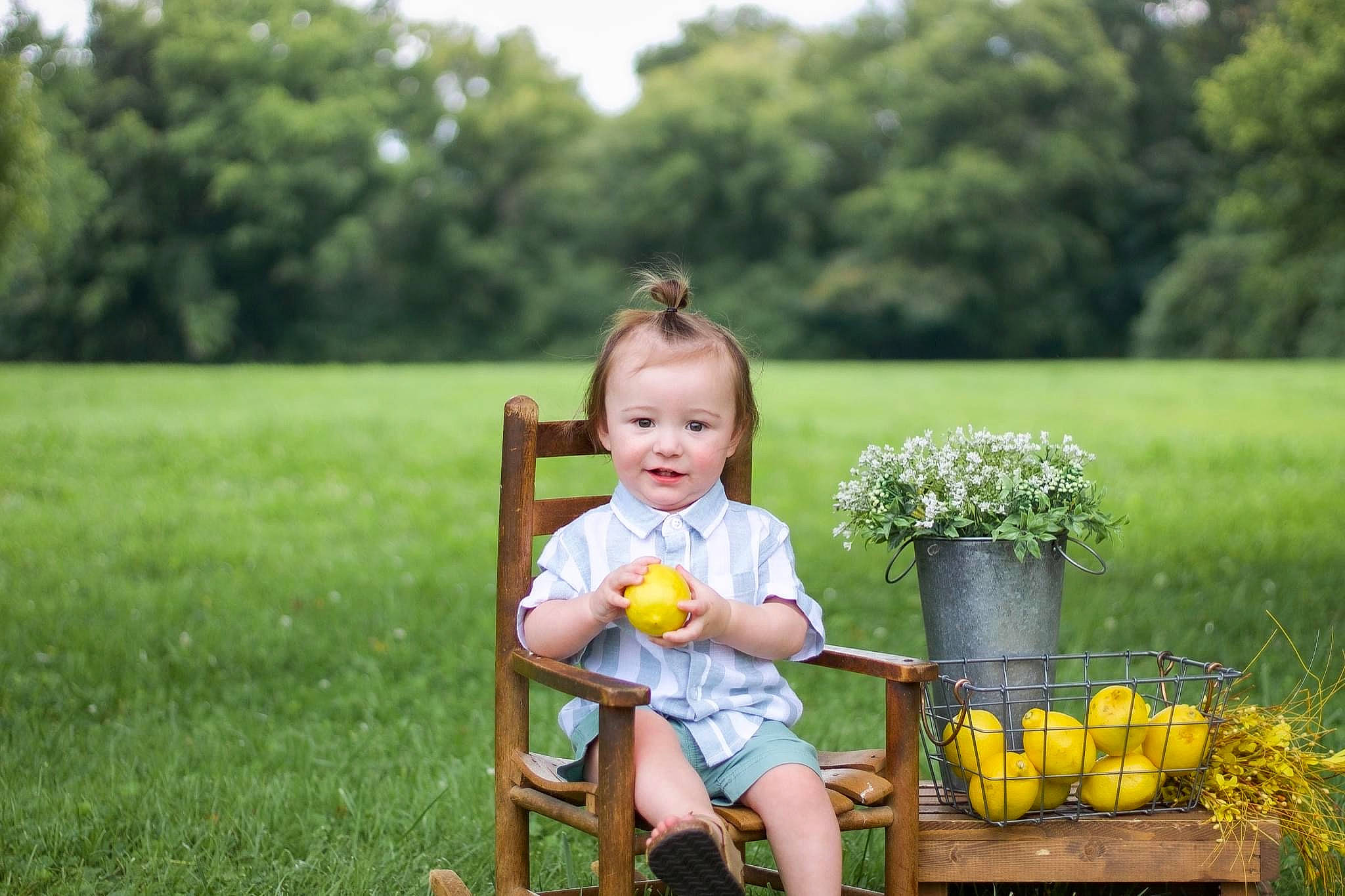 Kaycee joined the competition — help win amazing prizes! baby, botany, chair, facial_expression, flower, flowerpot, grass, green, happy, leaf, mammal, people_in_nature, person, photograph, plant, smile, standing, sunlight, tree, vertebrate