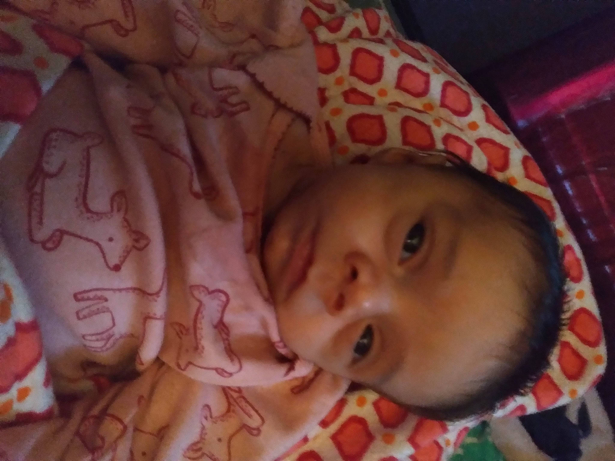 Stormy is registered to the contest to win money with this photo: baby, baby_products, baby_toddler_clothing, cheek, child, close_up, eyebrow, happy, human_body, iris, linens, lip, mammal, mouth, nose, person, pink, skin, smile, textile